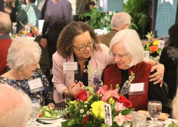 MSU staff members converse over lunch