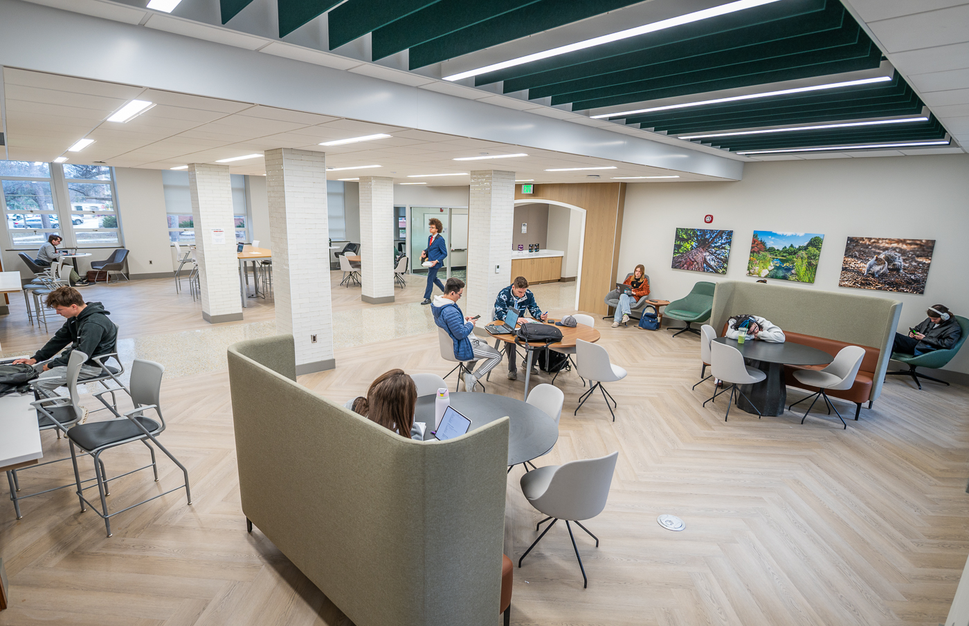 Inside the newly renovated space in Berkey Hall with students studying and sitting in couches and chairs