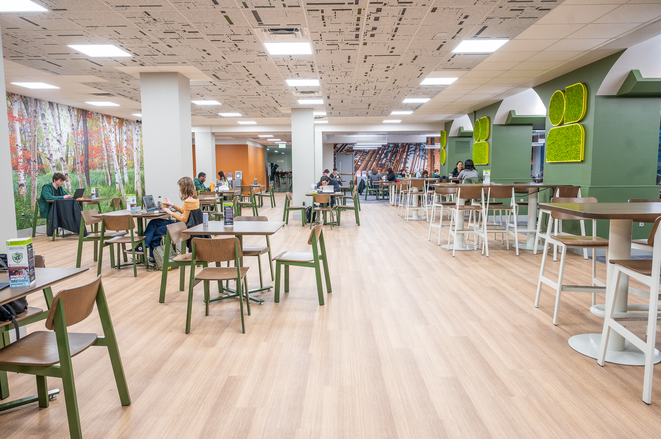 Inside the newly renovated space in the MSU Union with students sitting at tables