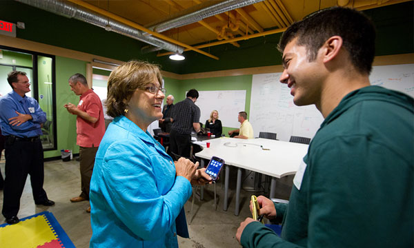 Two people talking at an event.