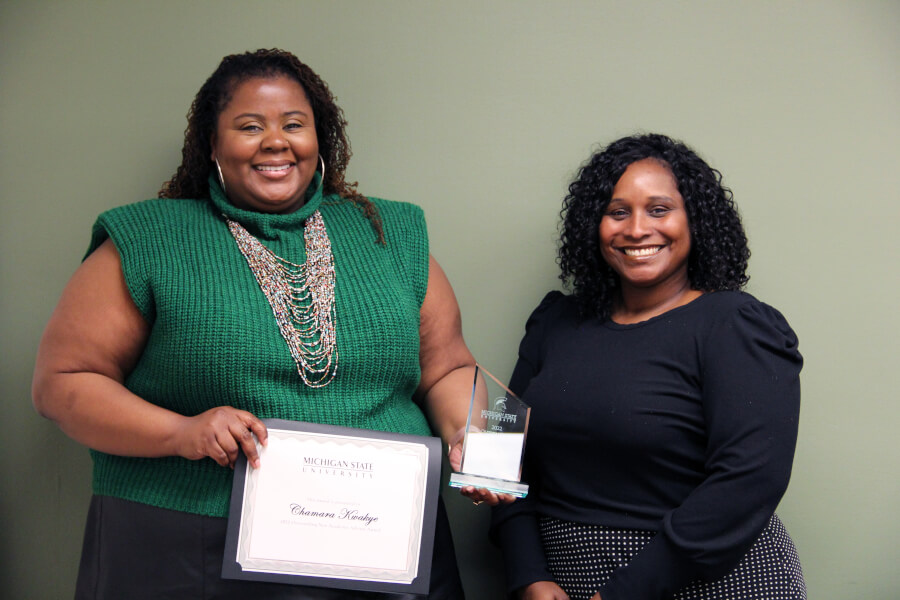 Chamara Kwakye, recipient of the 2022 Outstanding New Advisor Award, poses for a photo with Assistant Dean for University Advising Ebony Green at Michigan State University.