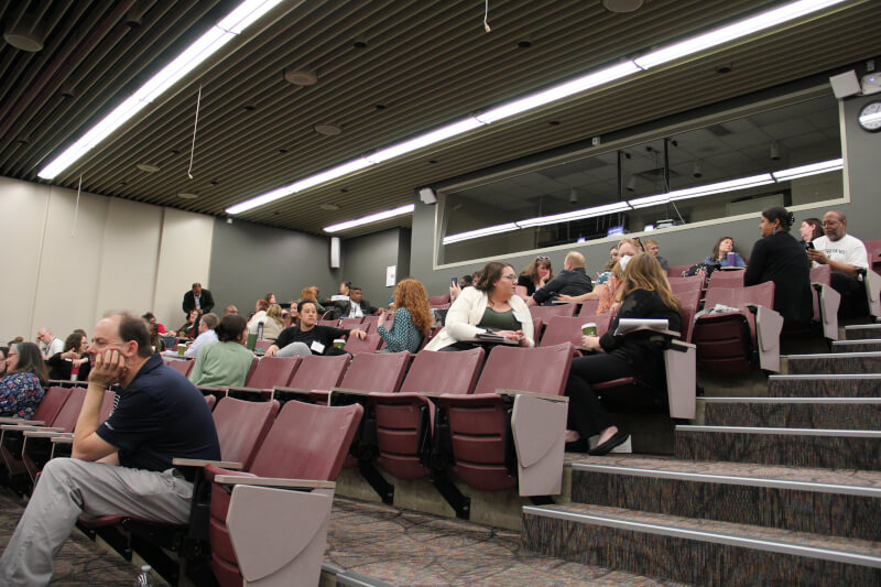 Faculty and staff listen to a presentation during the 2023 Student Success Summit at Michigan State University.
