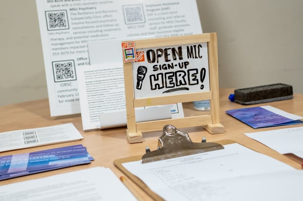 An open mic sign-up sheet at the entrance to the 'Reclaiming Space' event in the Union on Feb. 5, 2025. All participants were welcome to sign up for one of the 20 open mic spots as part of an event centered on self-love, reclaiming space, healing and grief.