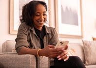 Woman on couch smiling