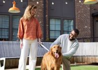Two people with dog in Bark Park