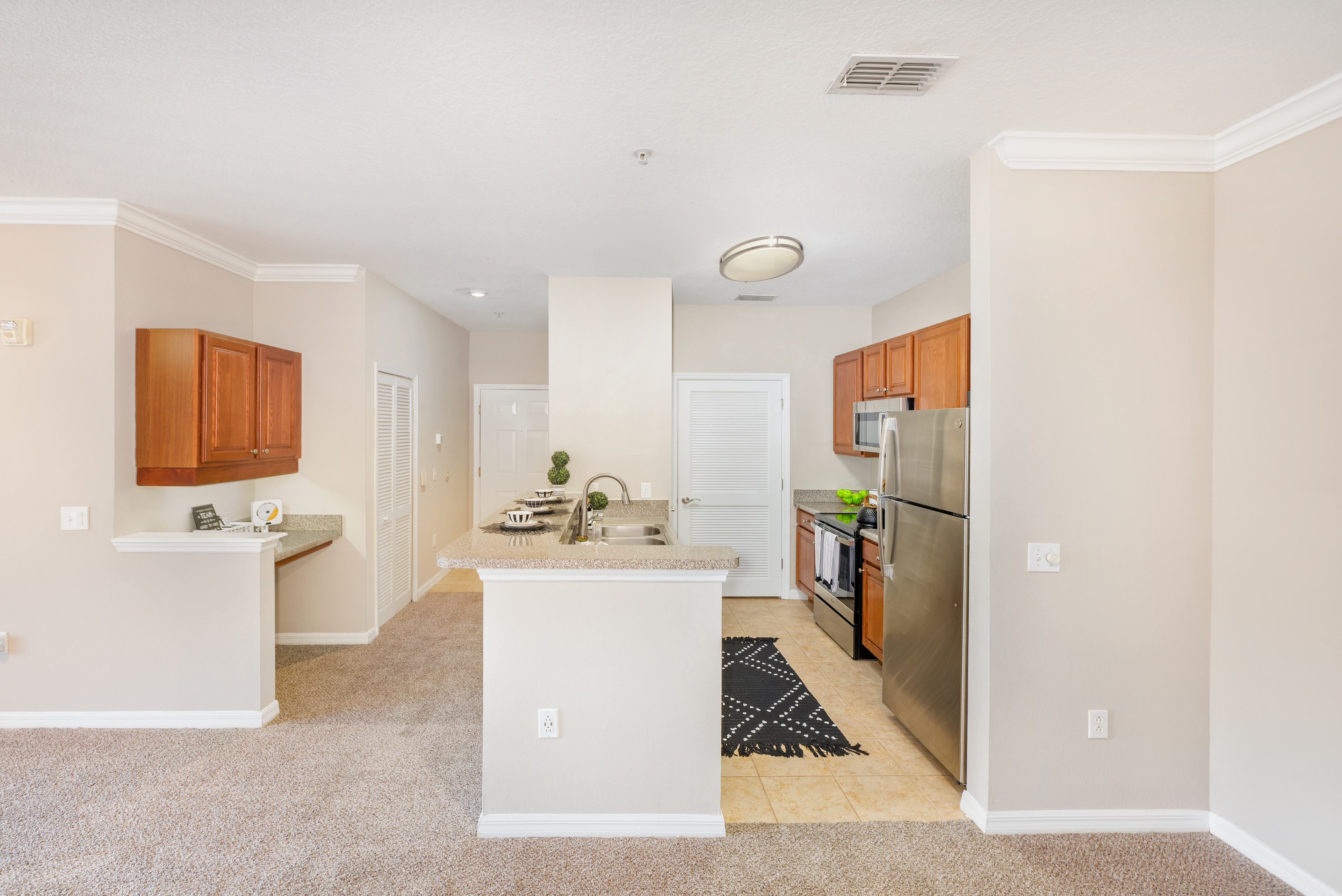 Kitchen and workspace at MAA Magnolia Parke luxury apartment homes in Gainesville, FL