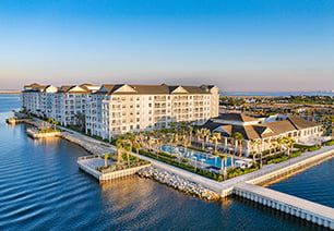 Aerial view of bayside saltwater pool and clubhouse situated at MAA Breakwater luxury apartments in Tampa, FL