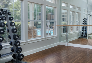 Fitness center with free weights in an open workout studio at MAA Barrett Creek luxury apartments in Marietta, GA
