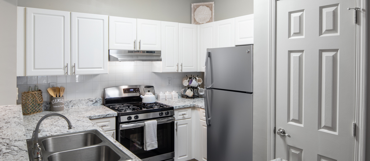 Upscale modern kitchen with stainless steel appliances and granite countertops at MAA Briarcliff luxury apartments in Atlanta, GA