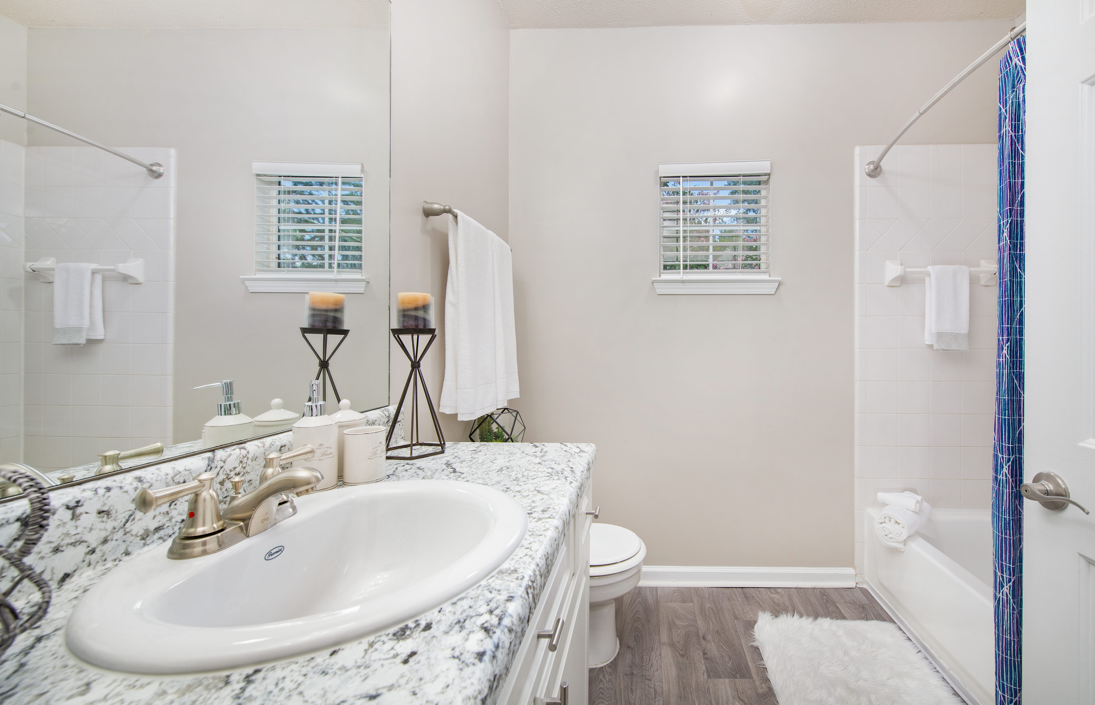 Spacious bathroom with single vanity sink and shower tub at MAA Briarcliff luxury apartments in Atlanta, GA
