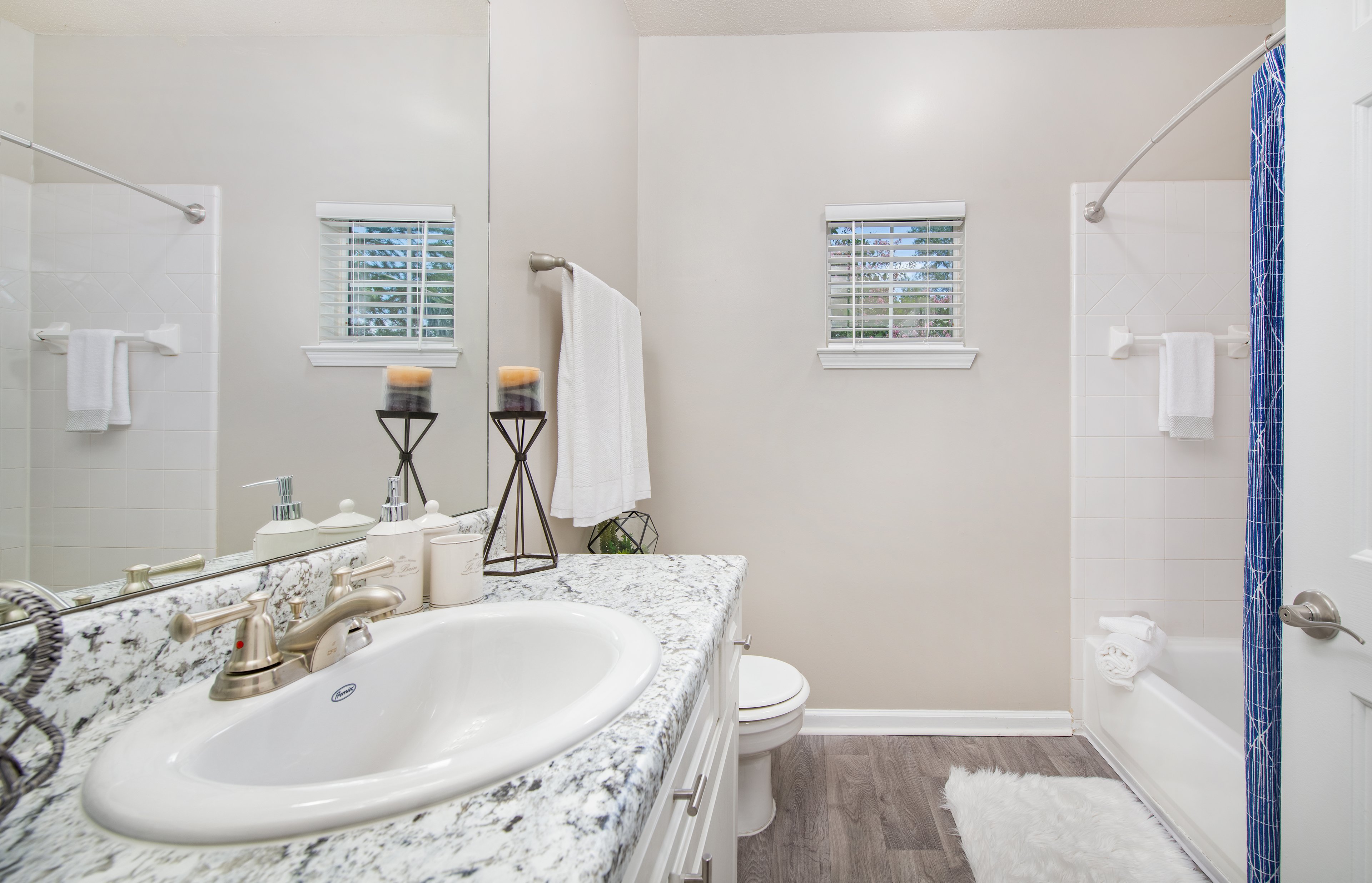 Spacious bathroom with single vanity sink and shower tub at MAA Briarcliff luxury apartments in Atlanta, GA