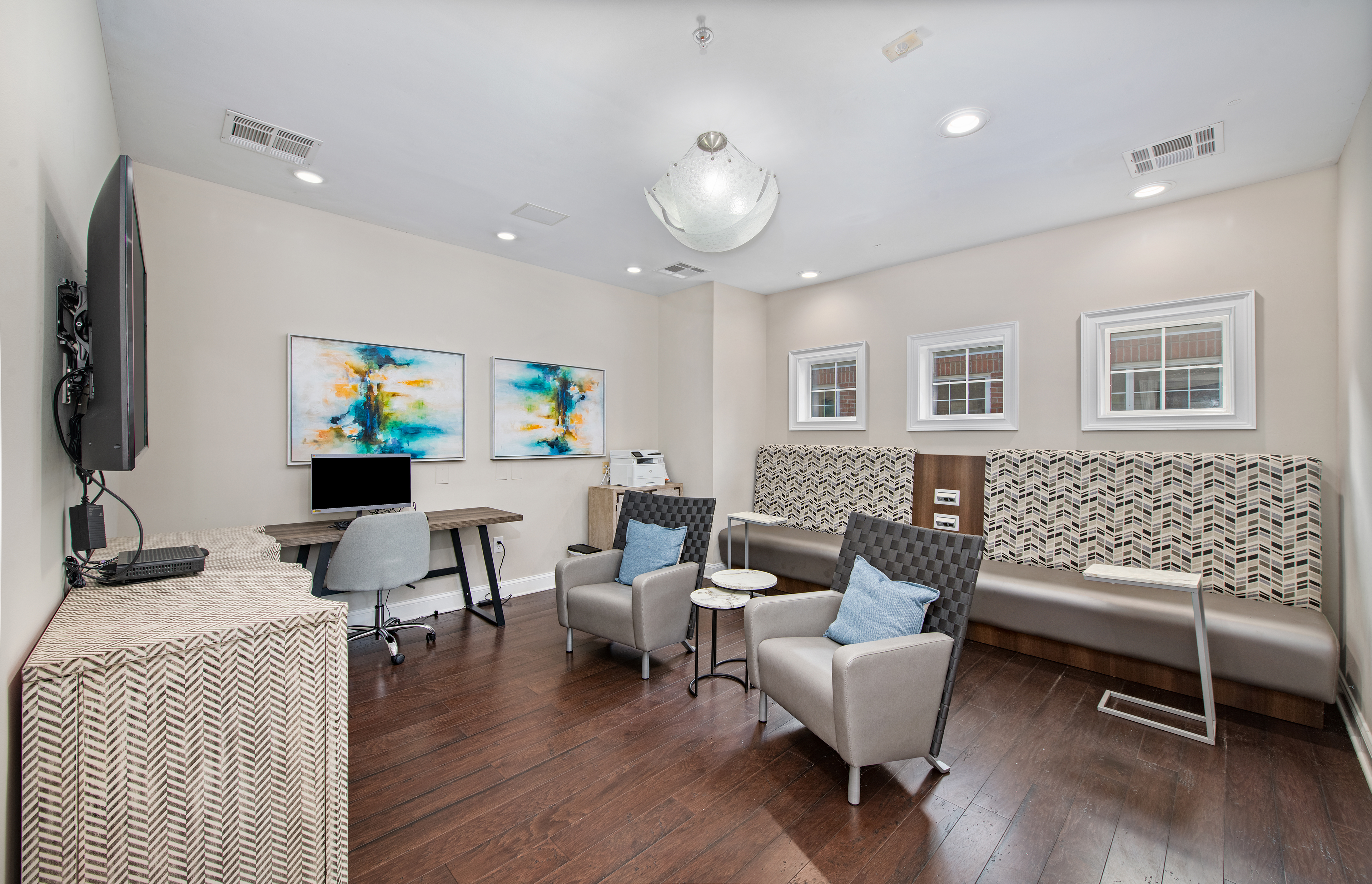 Business center with large TV and work stations at MAA Briarcliff luxury apartments in Atlanta, GA