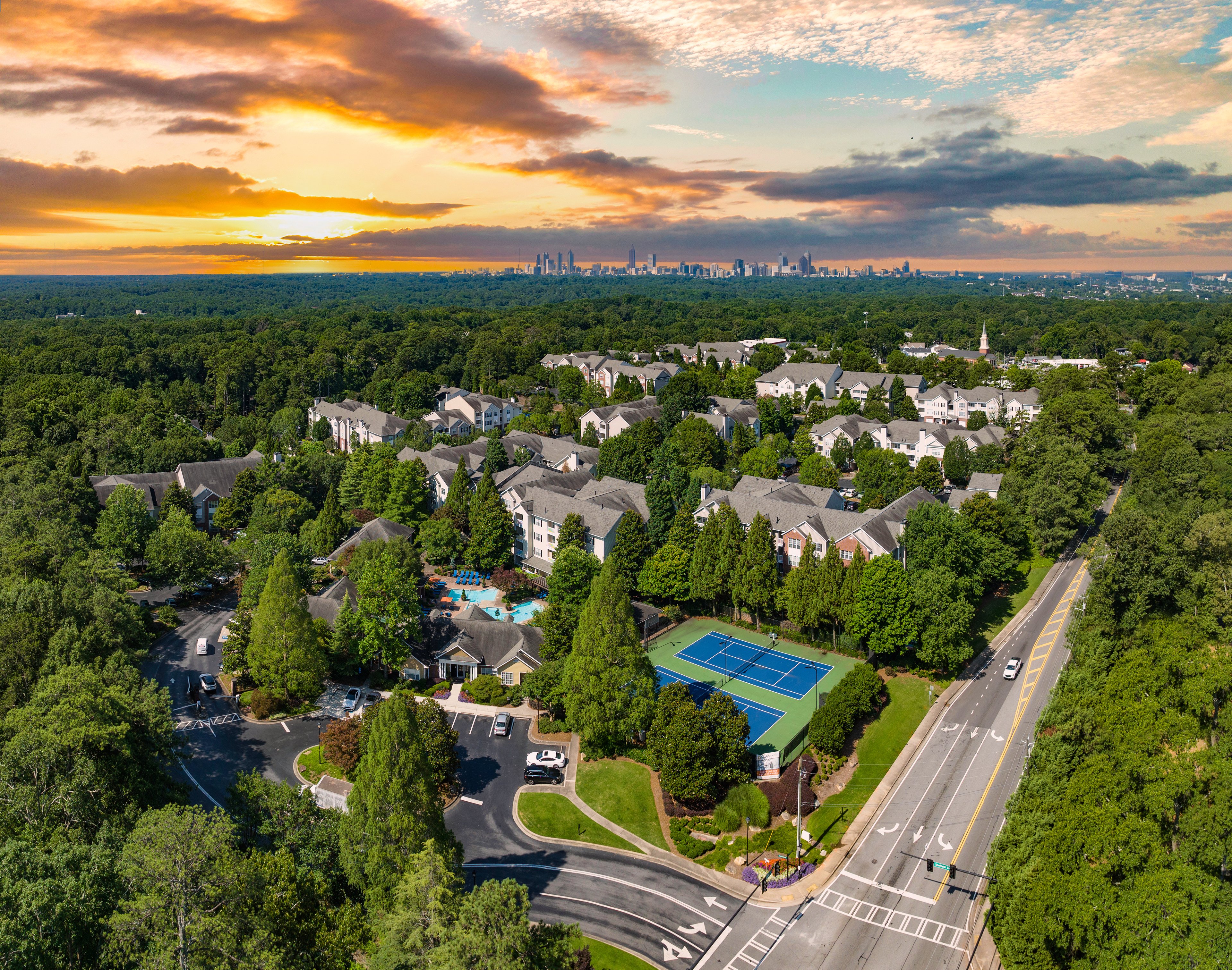 Aerial view of properties and tennis courts at MAA Briarcliff luxury apartments in Atlanta, GA