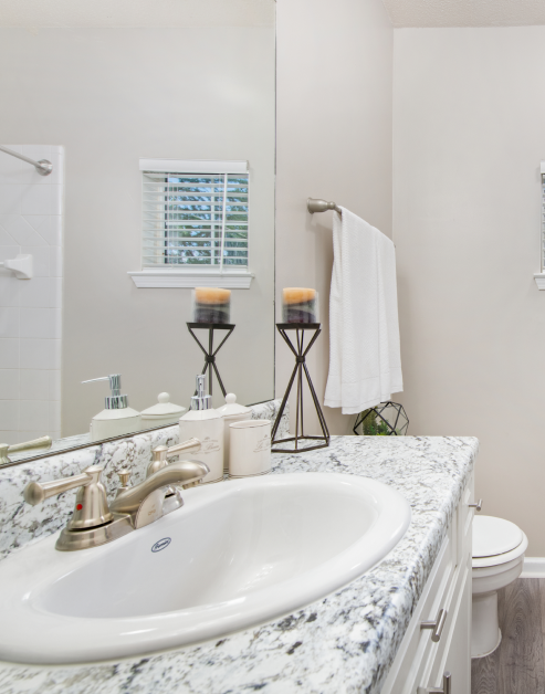 Spacious bathroom with single vanity sink and granite countertops at MAA Briarcliff luxury apartments in Atlanta, GA