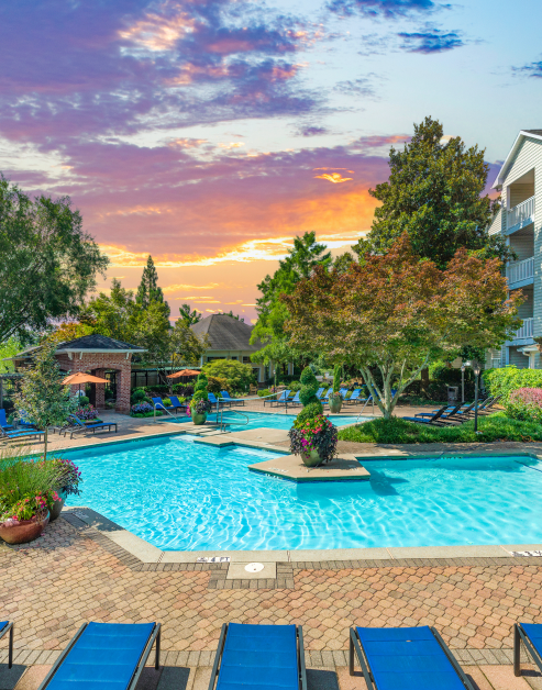 Main swimming pool with lounge chairs and at MAA Briarcliff luxury apartments in Atlanta, GA