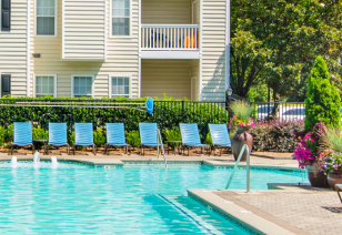 Side view of swimming pool with lounge chairs at MAA Briarcliff luxury apartments in Atlanta, GA