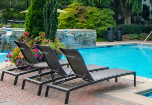 Relaxing lounge chairs by the pool at MAA Brookhaven luxury apartments in Atlanta, GA