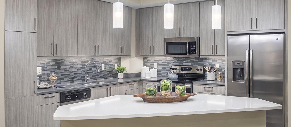 Large kitchen space with granite countertops and stainless steel appliances at MAA Centennial Park luxury apartments in Atlanta, GA