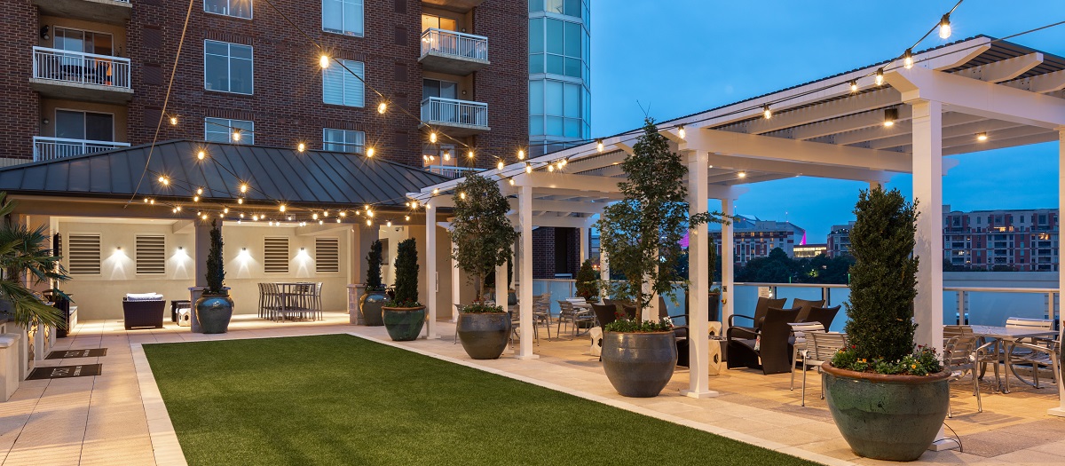 Rooftop pool at night with lounge areas at MAA Centennial Park luxury apartments in Atlanta, GA