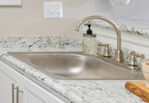 Modern kitchen with stainless steel sink at MAA Dunwoody luxury apartments in Atlanta, GA