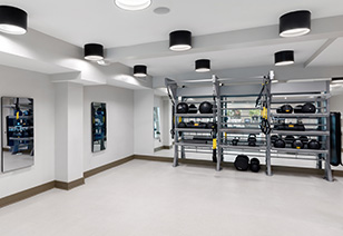 Fitness center studio room with racks of yoga and medicine balls at MAA Gardens luxury apartments in Atlanta, GA
