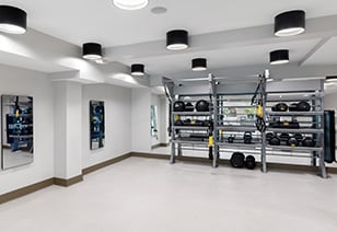 Fitness center studio room with racks of yoga and medicine balls at MAA Gardens luxury apartments in Atlanta, GA