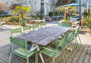 Poolside large patio table and chairs at MAA Gardens luxury apartments in Atlanta, GA