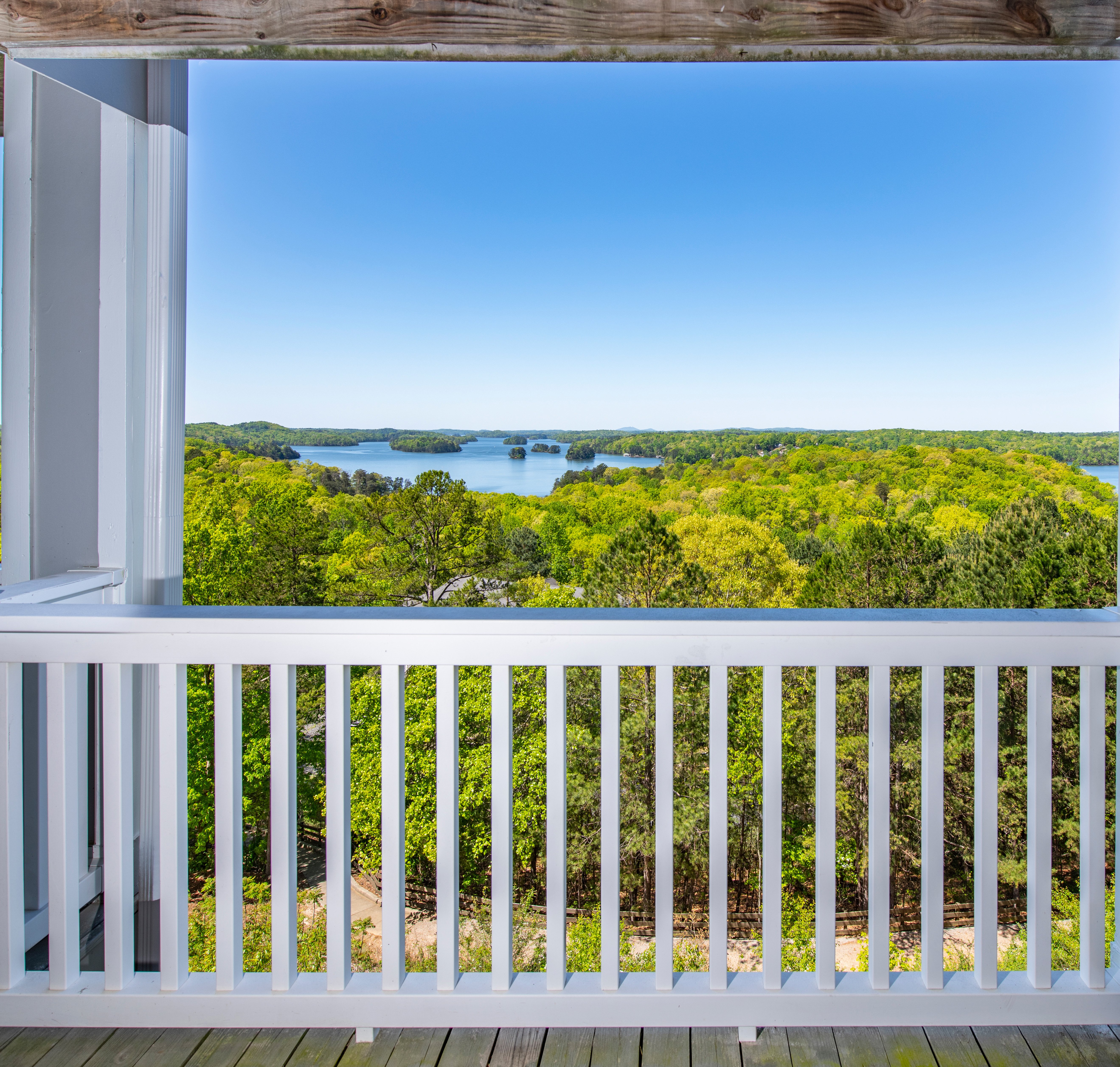 Apartment balcony view with white fence railing and lake views at MAA Lake Lanier luxury apartments in Gainesville, GA