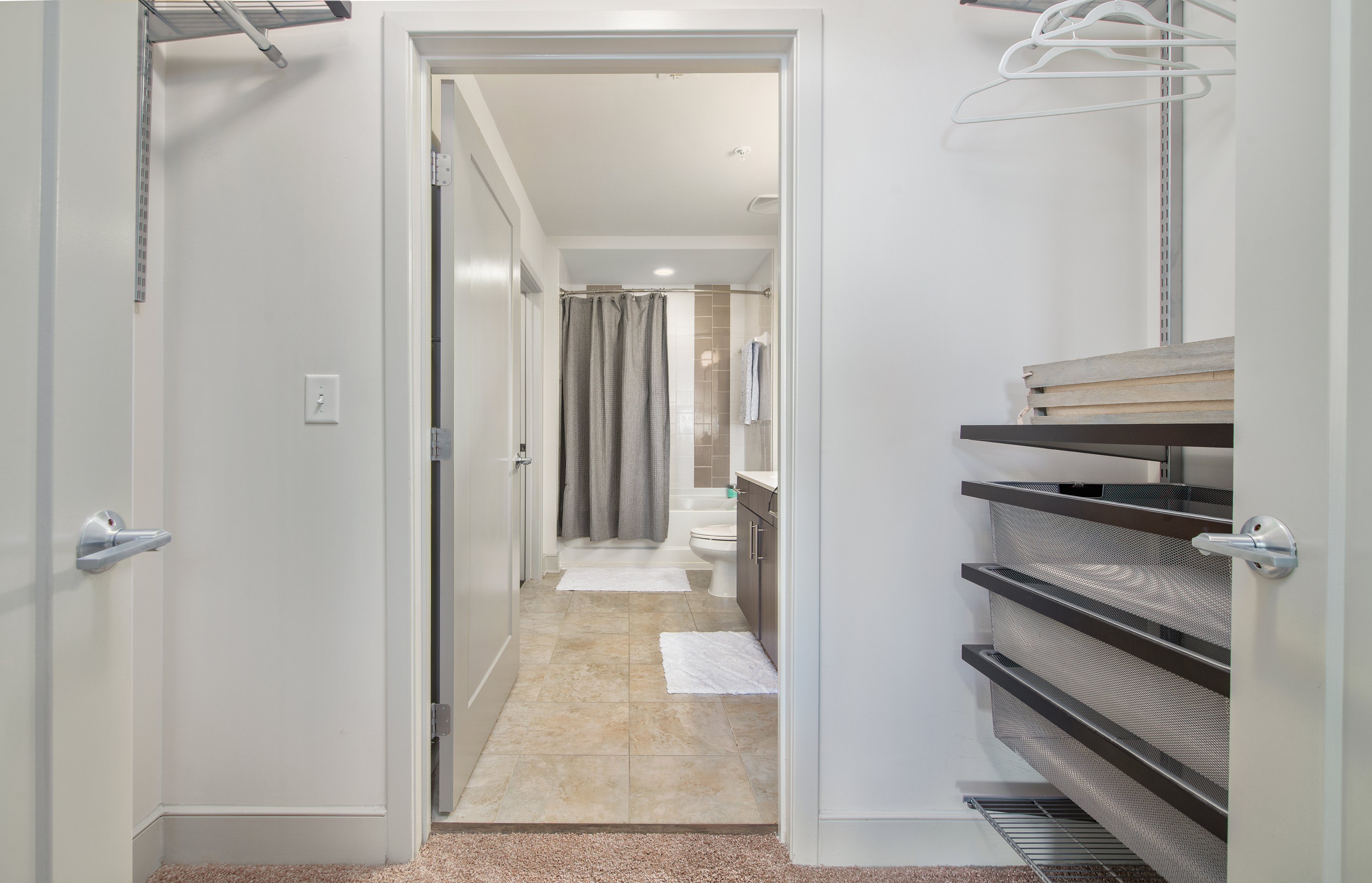 Bedroom closet and bathroom view of a property at MAA Lenox luxury apartments in Atlanta, GA