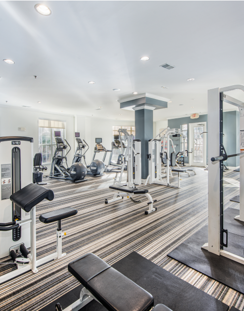 State of the art fitness center with ellipticals and weight machines at MAA Lenox luxury apartments in Atlanta, GA