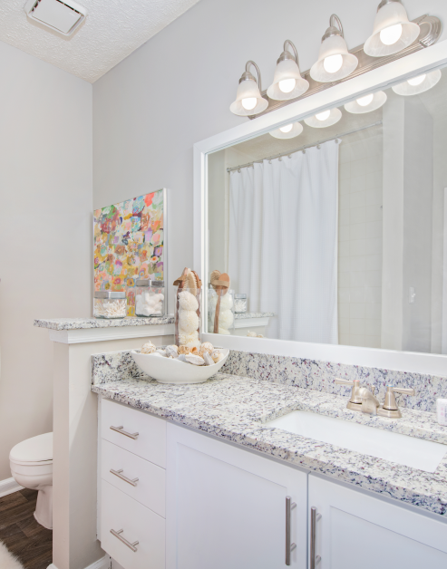 Modern bathroom with single vanity sink and grey marble countertops at MAA Oglethorpe luxury apartments in Atlanta, GA
