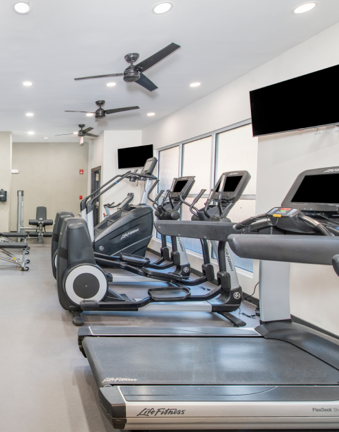 Fitness center treadmills with ceiling fans at MAA Piedmont Park luxury apartments in Atlanta, GA