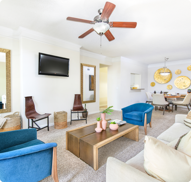 Model living room with modern retro décor next to dining area at MAA Pleasant Hill luxury apartments in Duluth, GA