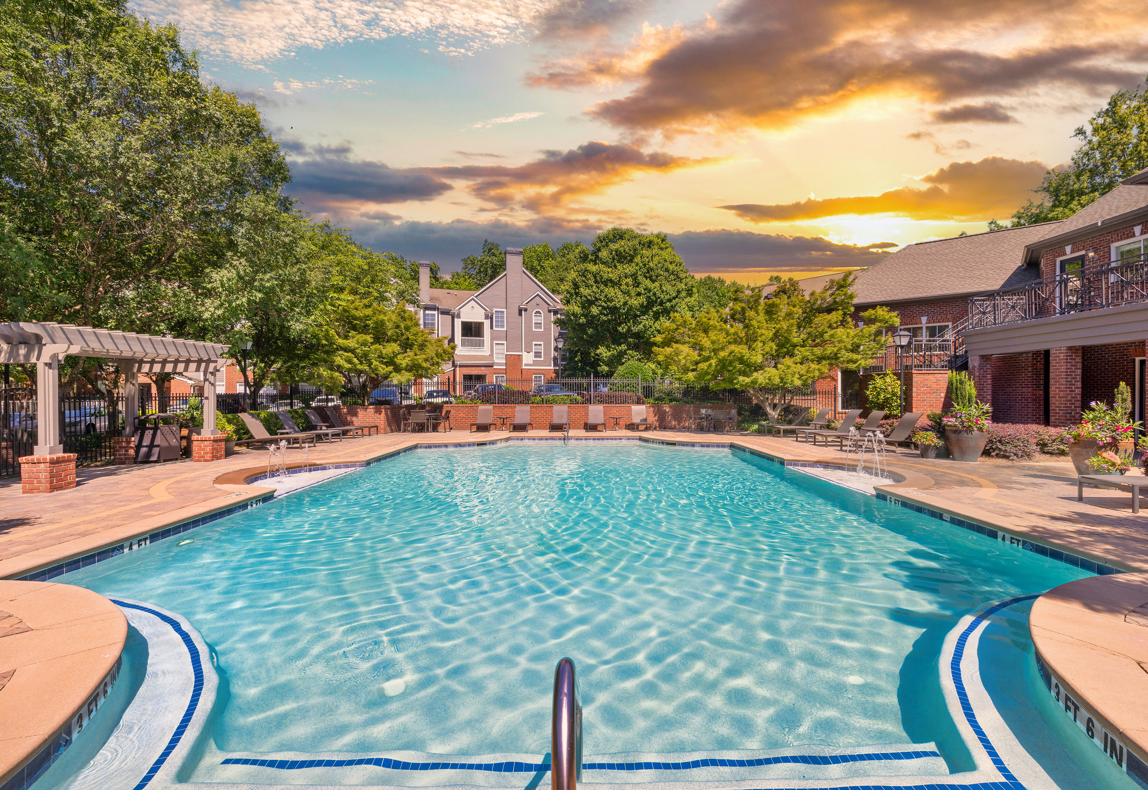 Pool view with pool steps with hand rails at MAA Shiloh luxury apartments in Kennesaw, GA