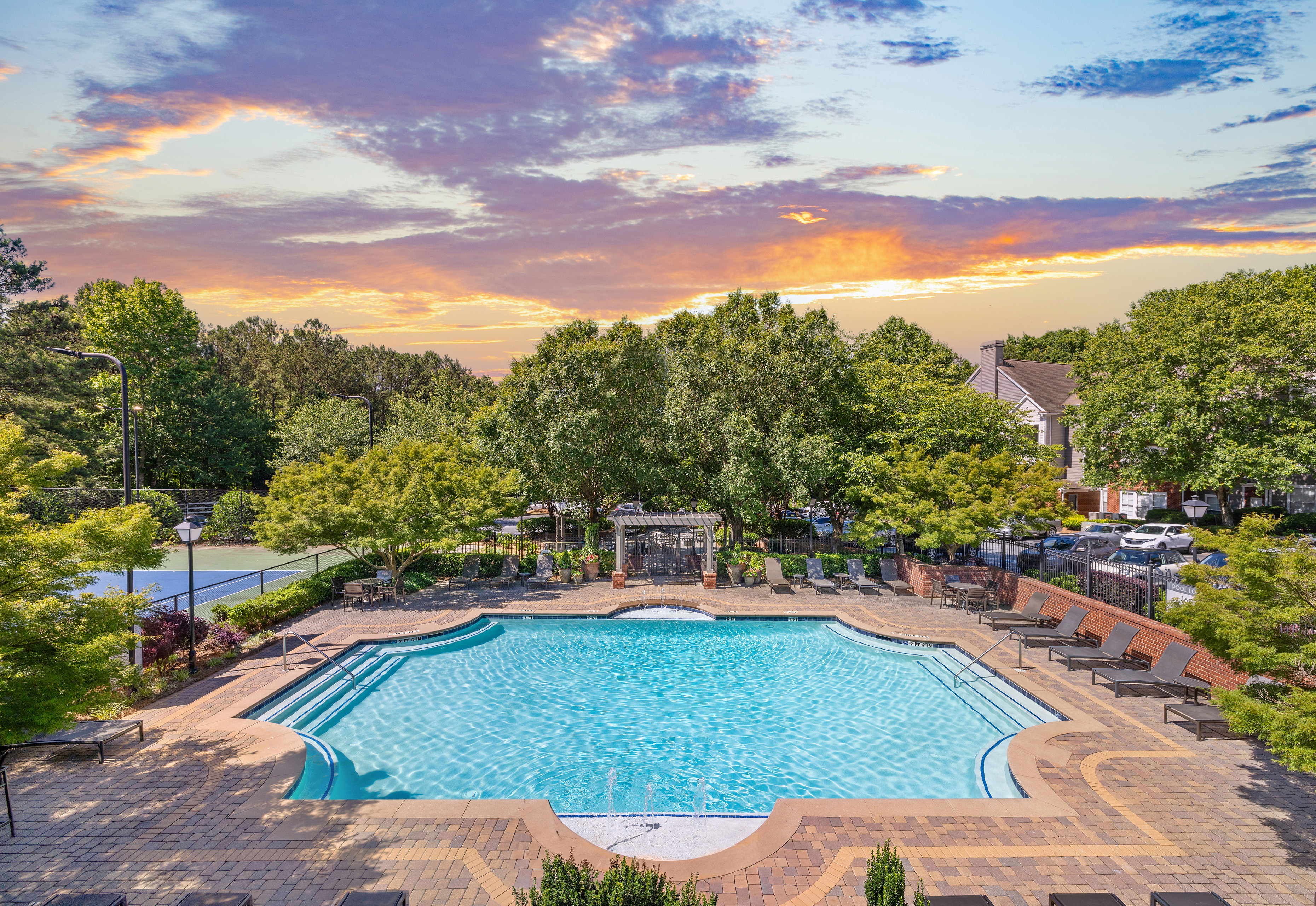 Aerial view of swimming pool surrounded by trees at MAA Shiloh luxury apartments in Kennesaw, GA