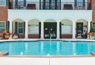 Swimming pool next to community clubhouse at MAA Spring luxury apartments in Smyrna, GA