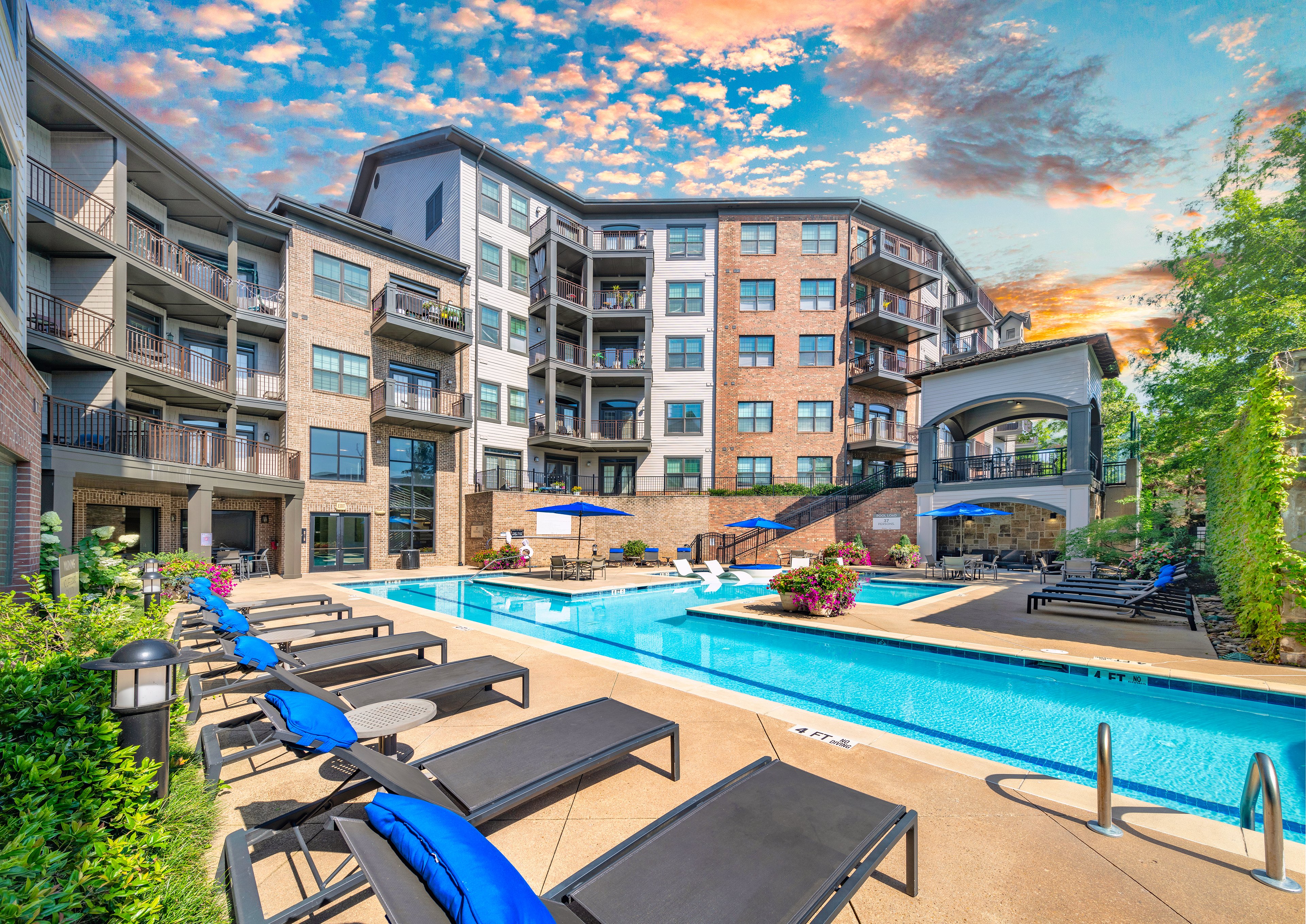 Side view of swimming pool and terrace lounge at MAA West Village luxury apartments in Smyrna, GA