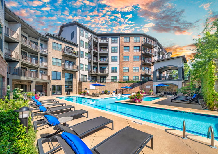 Side view of swimming pool and terrace lounge at MAA West Village luxury apartments in Smyrna, GA