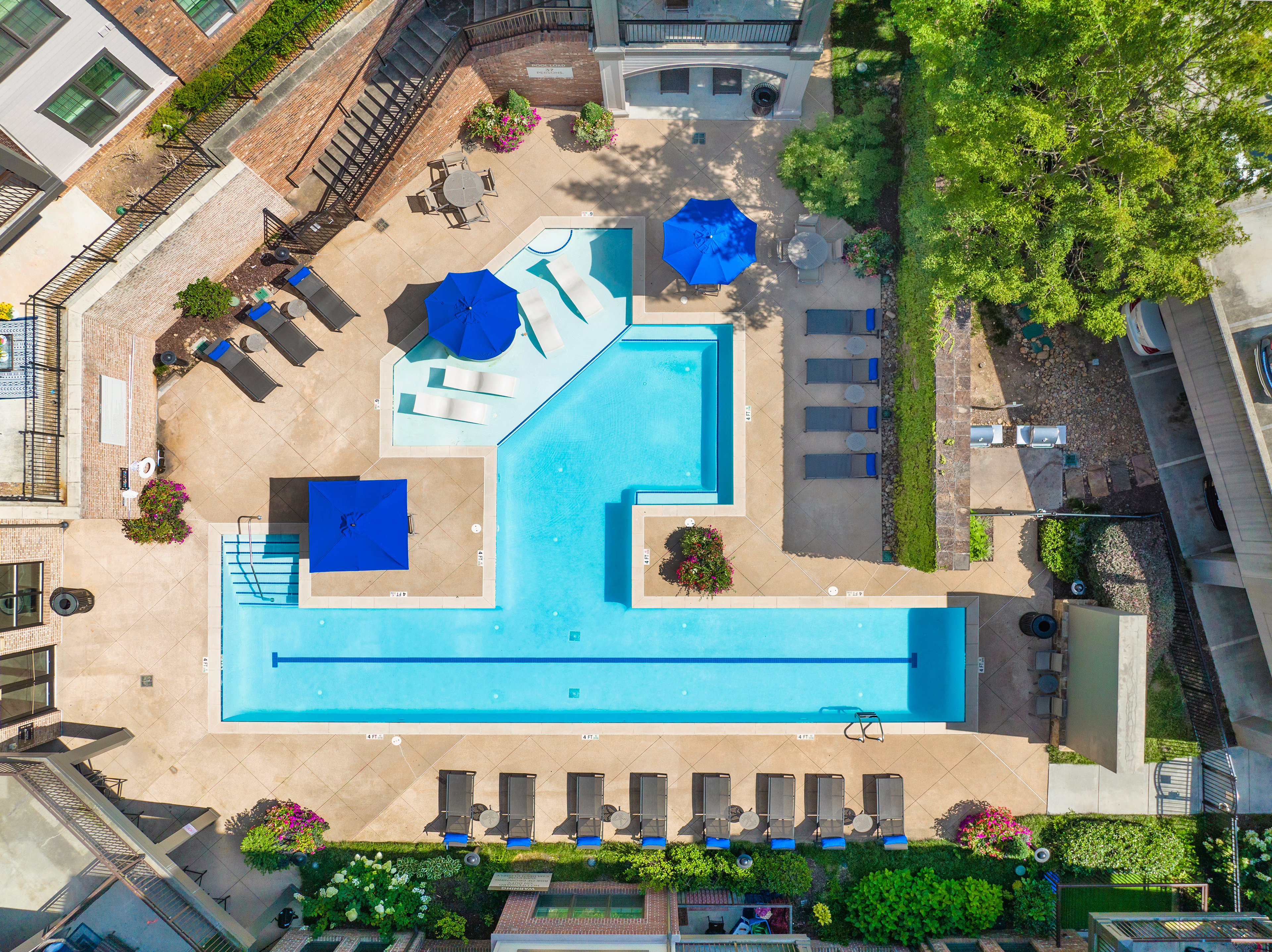 Top aerial view of swimming pool area at MAA West Village luxury apartments in Smyrna, GA