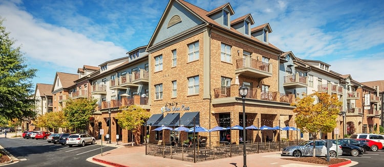 Exterior corner street view of MAA West Village luxury apartments in Smyrna, GA