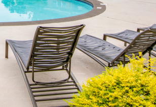 Close up of poolside lounge chairs at MAA Beverly Crest luxury apartments in Charlotte, NC
