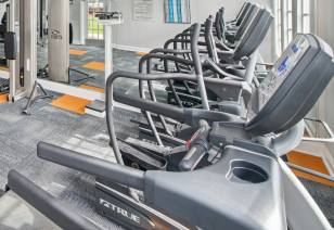 Fitness center with elliptical machines and other workout equipment at MAA City Grand luxury apartments in Charlotte, NC