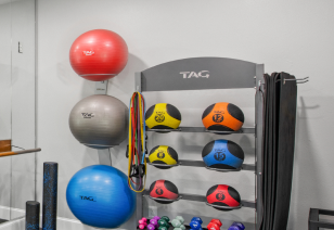Fitness center with yoga balls and weighted ball racks at MAA Cornelius luxury apartments in Cornelius, NC