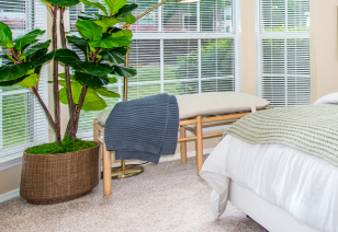 Close up of bedroom window and blinds next to sitting bench at MAA Fifty-One luxury apartments in Matthews, NC