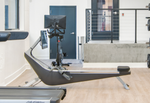 Close up of fitness center state-of-the-art rowing machine next to entrance door at MAA Gateway luxury apartments in Charlotte, NC
