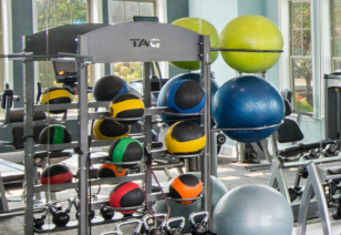 Close up of fitness center weighted medicine ball rack and yoga balls at MAA Huntersville luxury apartments in Huntersville, NC