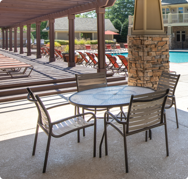 Community poolside large pergola with lounge chairs and patio areas at MAA Legacy Park luxury apartments in Charlotte, NC