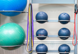 Close up view of fitness center yoga balls and weighted medicine ball rack at MAA Matthews Commons luxury apartments in Matthews, NC
