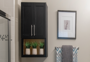 Close up of bathroom wall mounted cabinet, wall painting and towel rack at MAA Reserve luxury apartments in Charlotte, NC