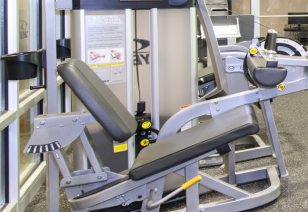 Close up view of leg extension machine in fitness center at MAA Reserve luxury apartments in Charlotte, NC